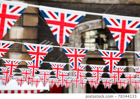 Strings of Union Jack bunts festive decoration in London England UK 78344133
