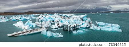 Melting icebergs at glacier lake Jokulsarlon Southeastern Iceland Scandinavia panorama Melting icebergs at glacier lake Jokulsarlon Southeastern Iceland Scandinavia panorama 78344815