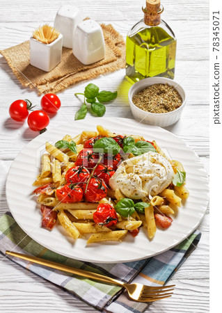 Italian pasta of penne, bacon, tomatoes, close-up 78345071