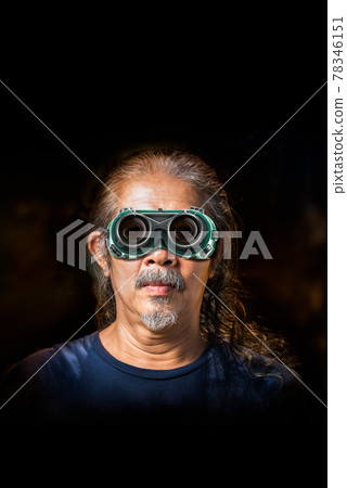 Old man and safety glasses 78346151