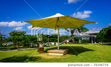 Okinawa's blue sky and blue sea, umbrellas near the general information center (Hi-Hi Plaza) of Kaiyohaku Park 78346734
