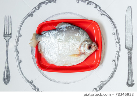 Palometa served on red plate Palometa served on red plate 78346938