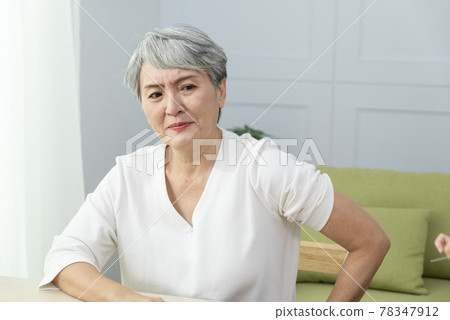 Elderly woman getting vaccinated 78347912