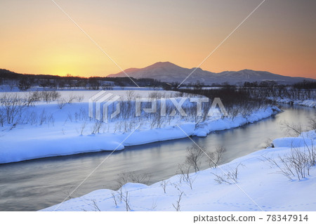 Afterglow Shiribetsu River and Niseko Mountain Range 78347914