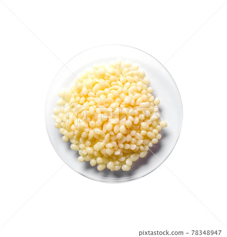 Candelilla Wax SP-75. Chemical ingredient for Cosmetics and Toiletries product on white laboratory table. Top View 78348947