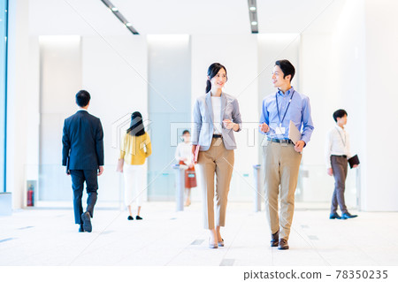 Business person walking in the lobby of an office building "LINK FOREST" Business person walking in the lobby of an office building "LINK FOREST" 78350235
