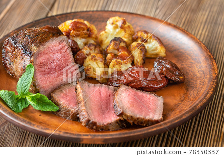 Grilled strip steak 78350337