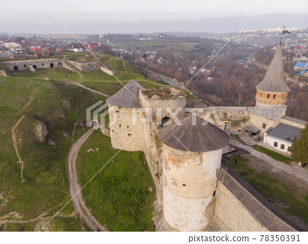 Aerial view of Fortress Castle at SUnrise in historic city of Kamianets-Podilskyi, Ukraine Aerial view of Fortress Castle at SUnrise in historic city of Kamianets-Podilskyi, Ukraine 78350391