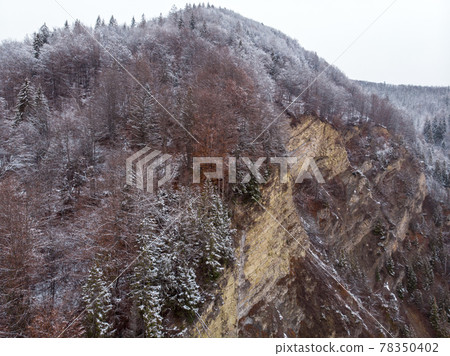 Wonderful landscapes of the Carpathian Mountains covered with snow at Cloudy Day in Ukraine near the village of Vyzhnytsia and River Cheremosh Wonderful landscapes of the Carpathian Mountains covered with snow at Cloudy Day in Ukraine near the village of Vyzhnytsia and River Cheremosh 78350402