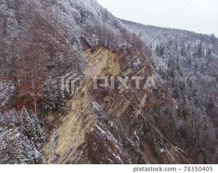 Wonderful landscapes of the Carpathian Mountains covered with snow at Cloudy Day in Ukraine near the village of Vyzhnytsia and River Cheremosh Wonderful landscapes of the Carpathian Mountains covered with snow at Cloudy Day in Ukraine near the village of Vyzhnytsia and River Cheremosh 78350405