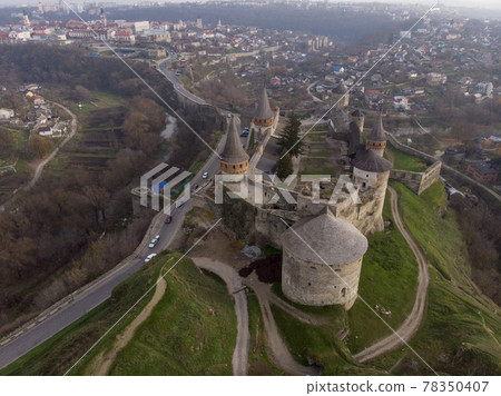 Aerial view of Fortress Castle at SUnrise in historic city of Kamianets-Podilskyi, Ukraine Aerial view of Fortress Castle at SUnrise in historic city of Kamianets-Podilskyi, Ukraine 78350407