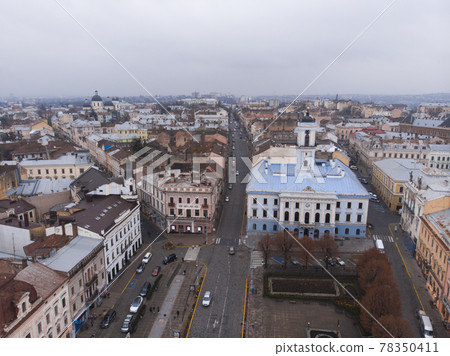 Aerial view of central part and City Hall of beautiful ancient ukrainian city Chernivtsi with its streets, old residential buildings, town hall, churches etc 78350411