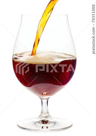 Pouring dark ale beer into a tulip glass isolated Pouring dark ale beer into a tulip glass isolated 78351008