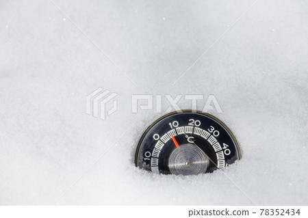 Snowed thermometer cold winter weather concept 78352434