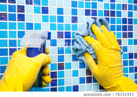 House chores - wiping bathroom wall with cleaning cloth and sprayer House chores - wiping bathroom wall with cleaning cloth and sprayer 78352453