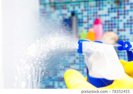 Spraying disinfectant on bathroom mirror protective measures against coronavirus epidemy 78352455