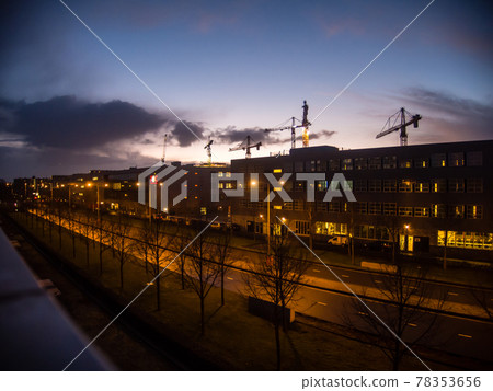 Amsterdam, the Netherlands, a large crane lined up with the sunset sky Amsterdam, the Netherlands, a large crane lined up with the sunset sky 78353656