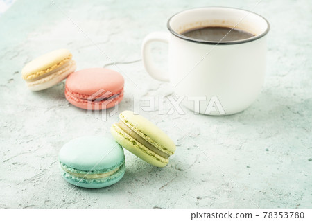 colorful macaroons and coffee on a table colorful macaroons and coffee on a table 78353780