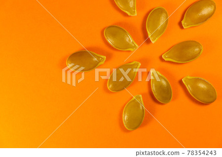 Pumpkin Seed Design Layout On Vibrant Orange Pumpkin Seed Design Layout On Vibrant Orange 78354243
