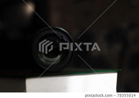 Lens in the dark close up, front view 78355014