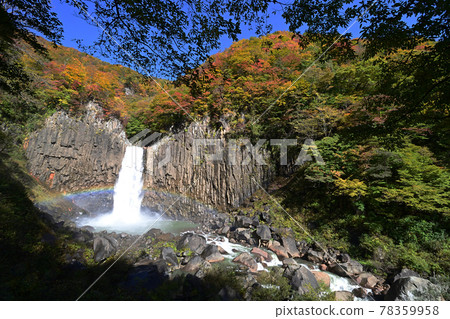 A rainbow appears in the Naena Waterfall basin of autumn leaves A rainbow appears in the Naena Waterfall basin of autumn leaves 78359958