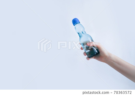 Hand holding a ramune bottle Hand holding a ramune bottle 78363572