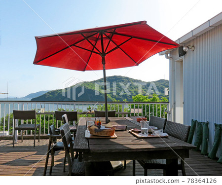 Cafe terrace with a view of the sea 78364126
