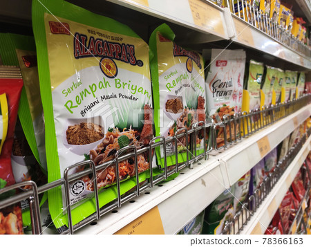 PENANG, MALAYSIA -JANUARY 5, 2021: Selected focused on the spices are sold in commercial packages and displayed on shelves in the supermarket. Sort by brand and type to make it easier to choose.  78366163