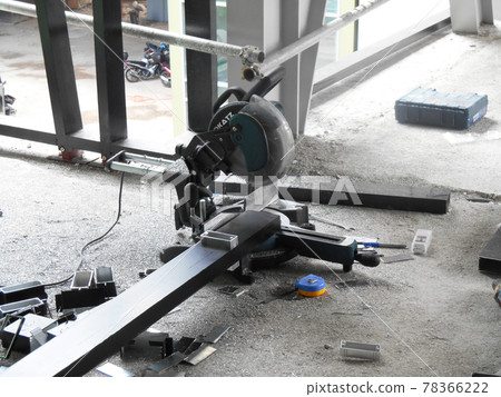 KUALA LUMPUR, MALAYSIA -JUNE 18, 2020: Mobile circular cutter used by the carpenter to cut plywood at the construction site.   78366222