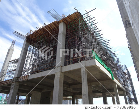 SEREMBAN, MALAYSIA -AUGUST 1, 2020: The concrete pillar structure is under construction at the construction site. The mold uses timber formwork and is temporarily supported with scaffolding. 78369986