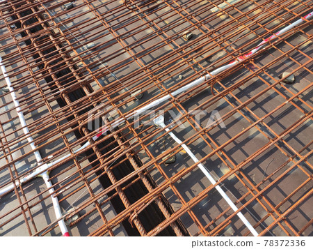 KUALA LUMPUR, MALAYSIA -NOVEMBER 23, 2020: Building floor slab under construction. Construction workers fabricating the timber formwork and installing the steel reinforcement bar. KUALA LUMPUR, MALAYSIA -NOVEMBER 23, 2020: Building floor slab under construction. Construction workers fabricating the timber formwork and installing the steel reinforcement bar. 78372336