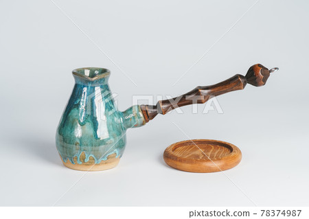 Turquoise ceramic cezve with wooden handle 78374987