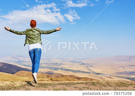 Beauty woman outdoors enjoying nature. 78375208