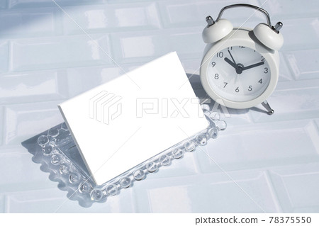 Clock and business card mockup on tile background 78375550