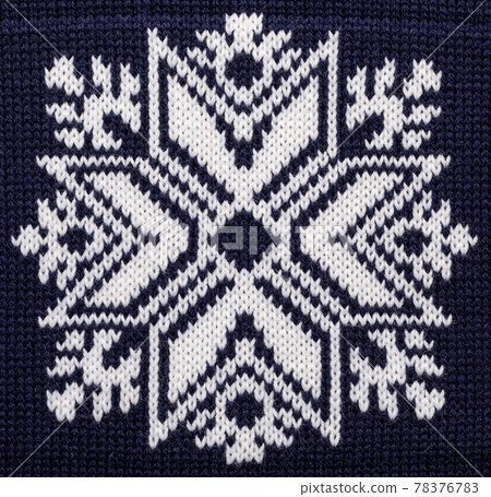 White knitted snowflake ornament on blue Christmas sweater 78376783