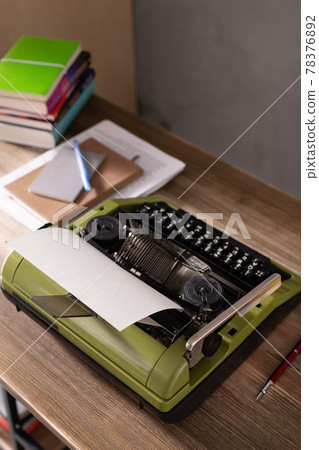 Vintage old typewriter at wooden desk table. Writer creative concept Vintage old typewriter at wooden desk table. Writer creative concept 78376892
