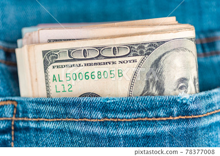 Dollars in jeans.Macro shot of trendy jeans with US dollar bills in a pocket. Financial concept. Dollars in jeans.Macro shot of trendy jeans with US dollar bills in a pocket. Financial concept. 78377008