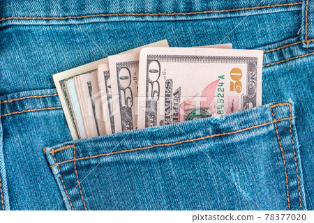 Dollars in jeans.Macro shot of trendy jeans with US dollar bills in a pocket. Financial concept. Dollars in jeans.Macro shot of trendy jeans with US dollar bills in a pocket. Financial concept. 78377020