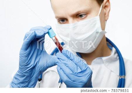 Doctor holding blood test tube 78379831