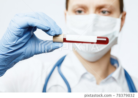 Doctor holding blood test tube Doctor holding blood test tube 78379832
