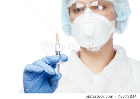 Doctor in protective suit holding syringe Doctor in protective suit holding syringe 78379834