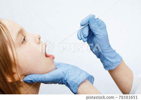 Pediatrician taking saliva test sample Pediatrician taking saliva test sample 78381651