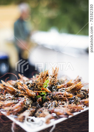 gourmet kampot pepper sauce prawns in modern outdoor bar 78382380