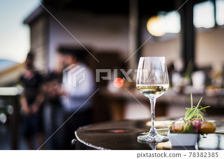 glass of white wine with gourmet food tapa snacks outside glass of white wine with gourmet food tapa snacks outside 78382385