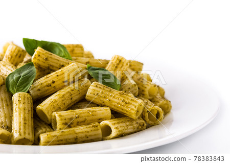 Penne pasta with pesto sauce and basil on a plate 78383843