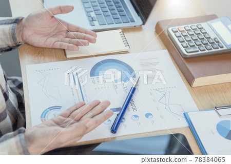 Businesspeople working in finance and accounting Analyze financial graph budget and planning for future in office room. Businesspeople working in finance and accounting Analyze financial graph budget and planning for future in office room. 78384065