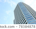 A tower condominium towering over the metropolitan area 78384878