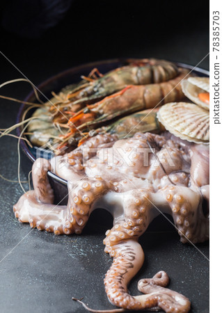 Assortment of raw seafood 78385703