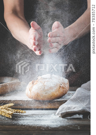 Baker cooking bread. Baker cooking bread. 78385712