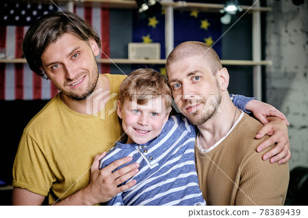 Two happy men and little boy 78389439